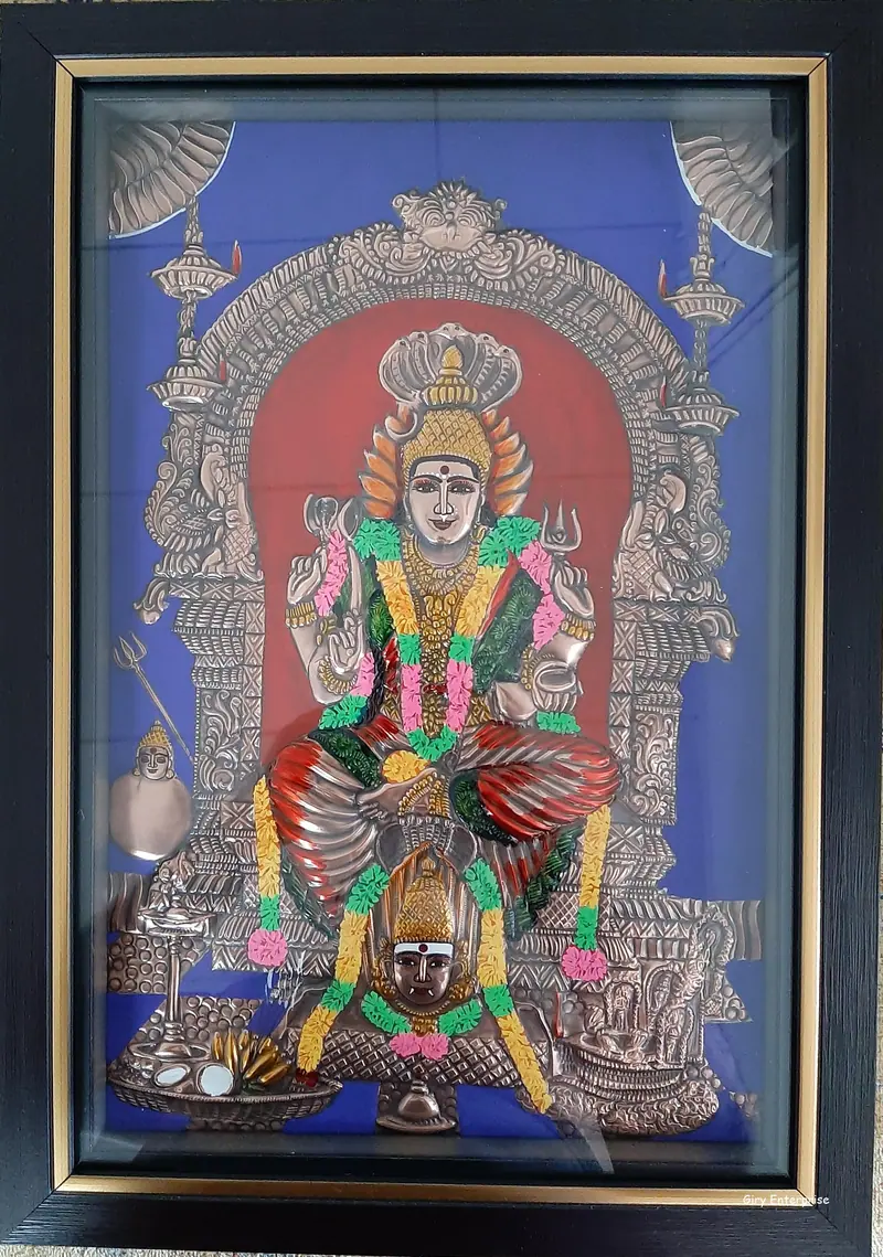 Karumariamman in the antique finish, the recesses left dark against polished copper