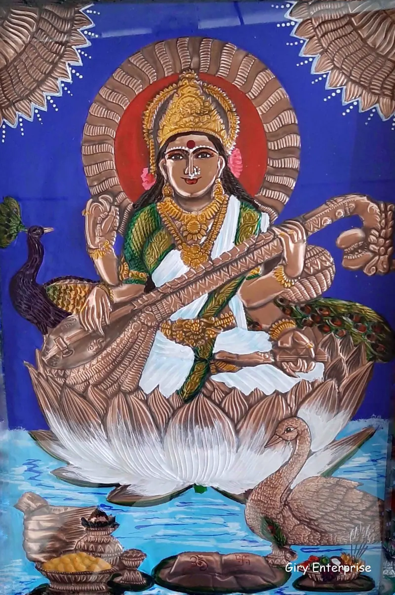 Saraswathi in the antique finish, veena and lotus picked out in polished copper