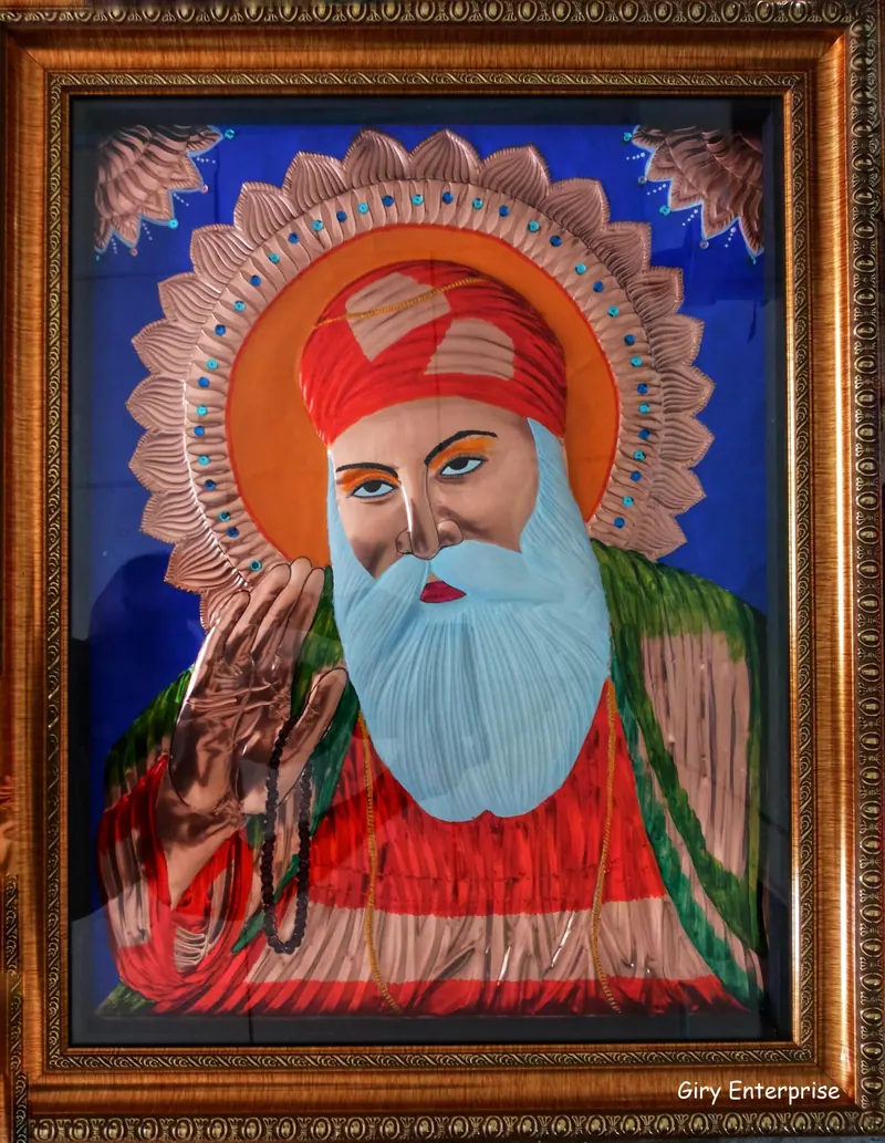Guru Nanak in hand-tooled copper, painted and framed, full frontal view