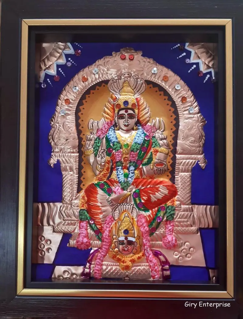 Karumariamman in hand-tooled copper, painted and framed, full frontal view