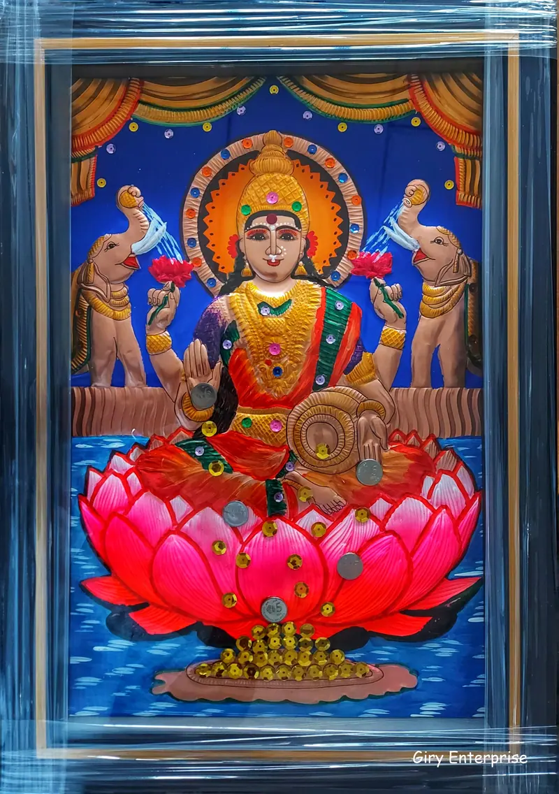 Mahalakshmi in hand-tooled copper, painted and framed, full frontal view
