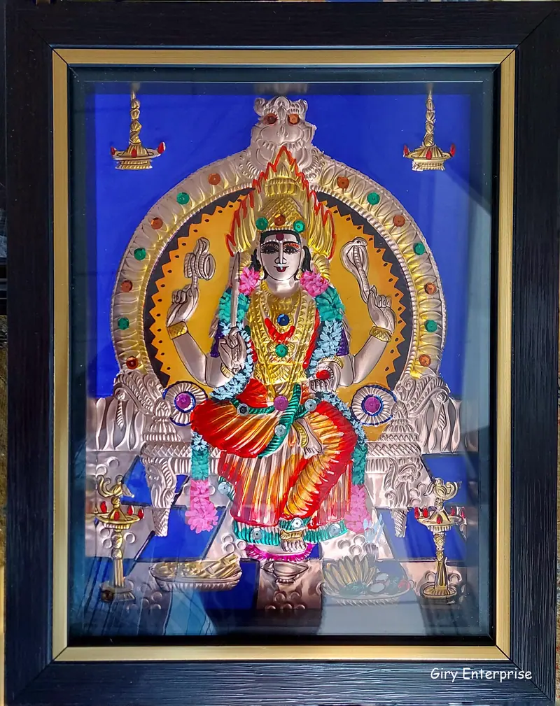 Mariamman in hand-tooled copper, painted and framed, full frontal view