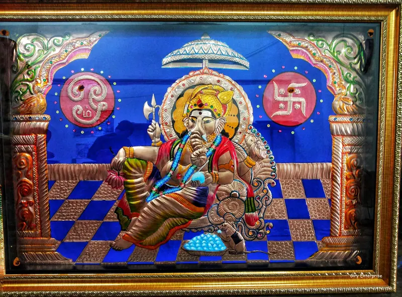 Raja Vinayagar in hand-tooled copper, painted and framed, full frontal view